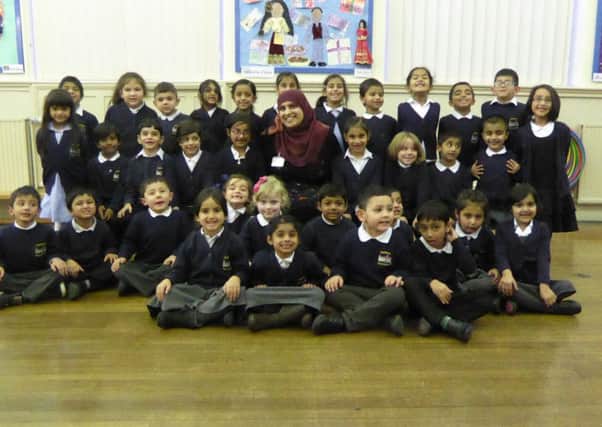 Reading: Purlwell pupils with headteacher Safeena Nazam