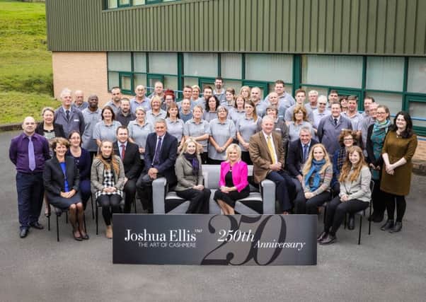Workers at Joshua Ellis pose for a photograph to mark the firms 250th anniversary.
