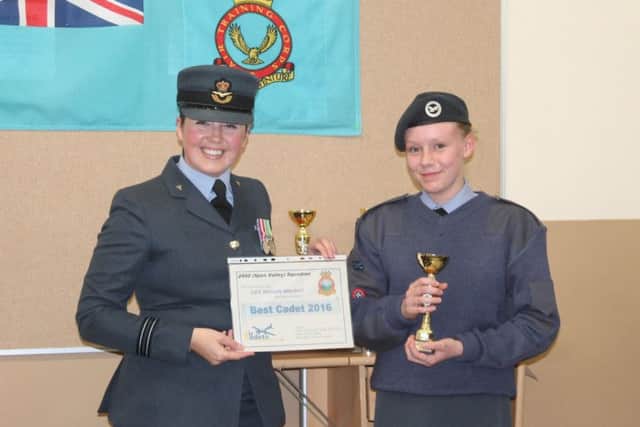 Best Cadet of the Year Megan Wright, who will have her name engraved on the squadron plaque, is pictured with FLt Lt Martin.