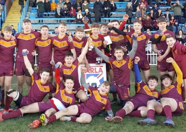 Just Champion: Dewsbury Moor Under-15s celebrate winning the BARLA Yorkshire Cup after defeating Skirlaugh Bulls in a thrilling final at Featherstone Rovers.
