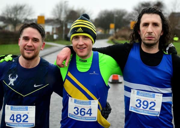 Liversedge half marathon winner Jason Cherriman (centre no 364), is joined by runner-up Ian Harding (right 392) and third placed Adam Peers (left, 482). Pictures: Paul Butterfield.
