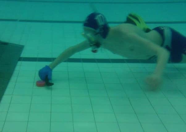 Batley's Matthew Dawson competing for the North of England Under-14s under water hockey team.