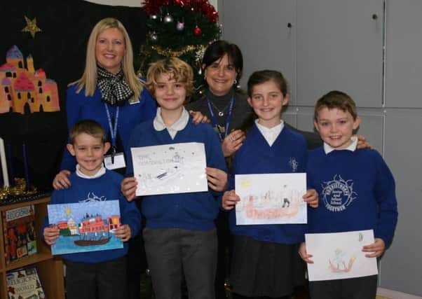 POSTER CONTEST: Staff at Norristhorpe School with some of the pupils who entered the competition.