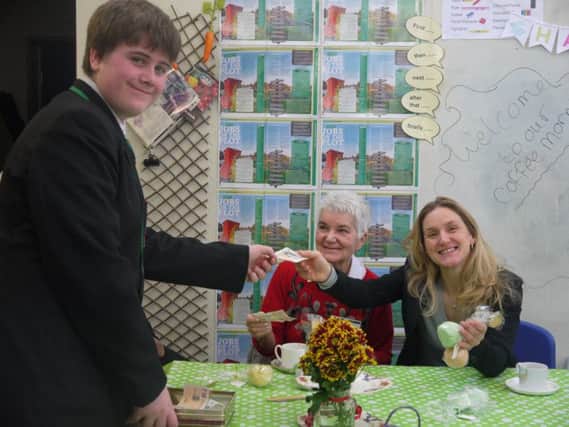 CUPPA AND CAKE: Upper Batley High School students look after customers at their pop-up cafe.
