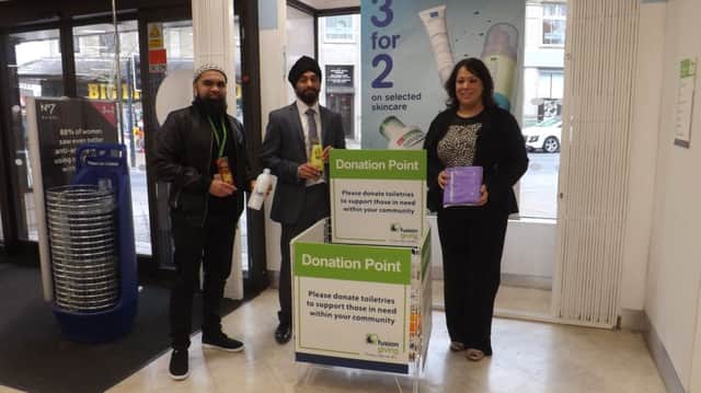 Ridhwan Nadat ,Fusion Food Bank co-ordinator, with Boots store manager Jesmeet Notay and Paula Sherriff MP at the new donation point.