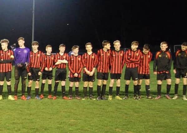 Gomersal and Drighlington Under-15s line up before last Thursdays Heavy Woollen District FA Blackburn Cup final, which was played out in front of a large crowd at Liversedge FC.
