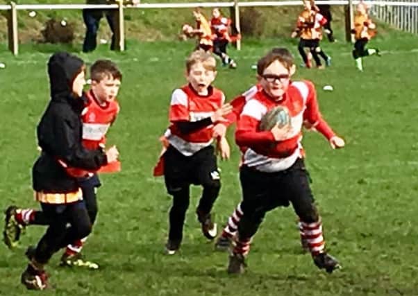Cleckheaton Under-8s on attack during their game against combined West Leeds and Bradford side.