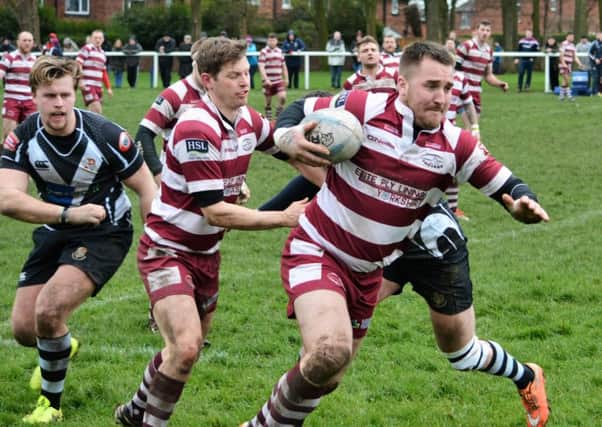 Liam Green sets up a Thornhill attack against Saddleworth