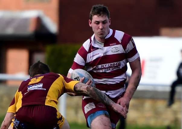 Jake Wilson scored two tries in a man-of-the-match display as Thornhill Trojans swept aside Drighlington to maintain their impressive start in National Conference League Division Two last Saturday.