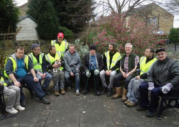 VOLUNTEERS: Batley Cemetery Group and Transformers North members rest during the clean-up.