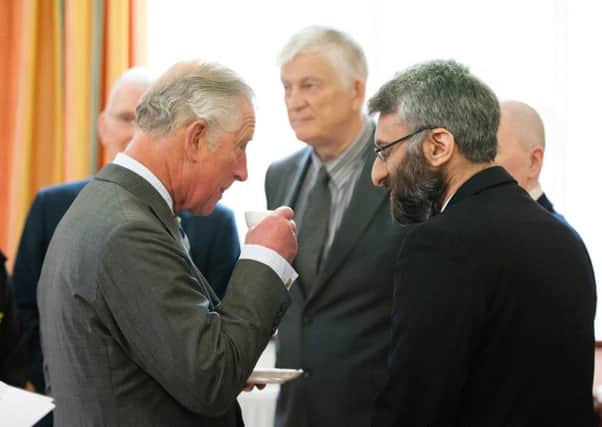 ORGANISATION THANKED: Dewsbury Resident Arif Ahmad is pictured with the Prince of Wales at the special reception.