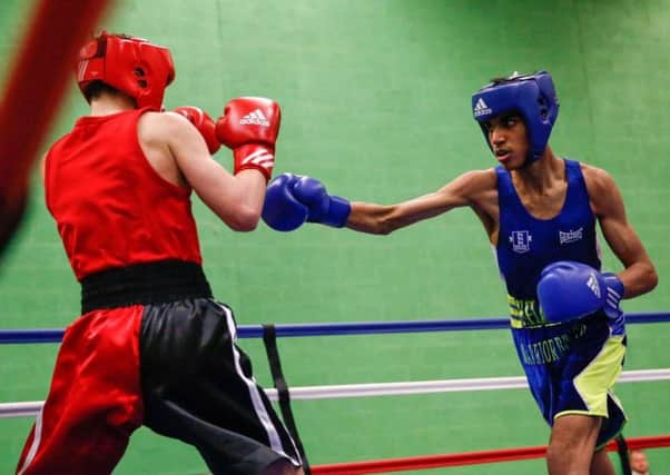 Warrior Breed boxer Khalid Ayub on his way to winning a third national boxing title.