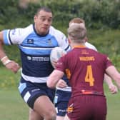 A Dewsbury Moor defender faces up to Hunslet Warriors captain and man-of-the-match Caldon Bravo during last Saturdays National Conference Trophy clash.