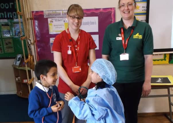 ACTIVITIES: Children at Lydgate school with Abbey House vets.