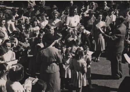 1948 PHOTO: Harry Hirst conducts singing at the Hanging Heaton Ebenezer Methodists Whit Walk