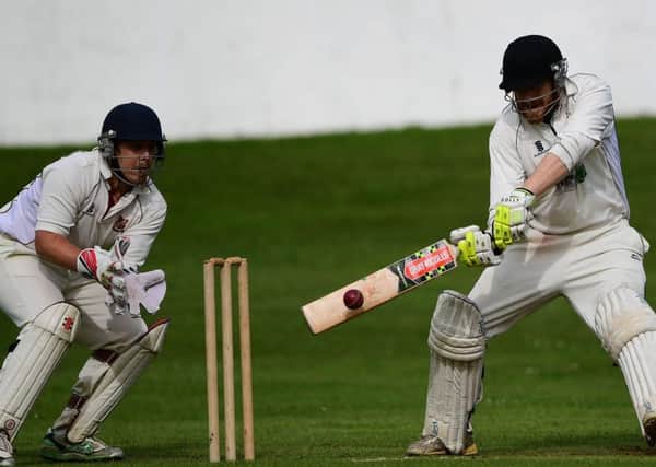Hopton Mills batsman Ashley Mackereth cuts the ball away on his way to a top score of 41 during last Saturdays Bradford League Championship Two game against Altofts.
