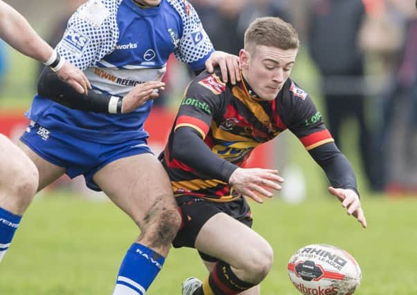 Sam Ottewell scored a try and a hand in two others as Shaw Cross Sharks booked their place in the Jim Brown Heavy Woollen Cup semi-finals with victory over Dewsbury Moor last Friday.