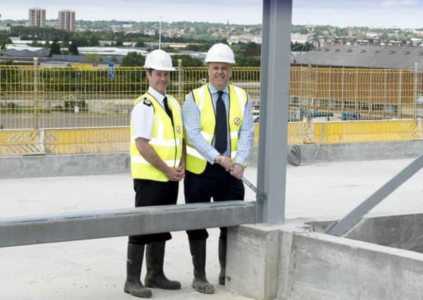 Chief Constable Mark Gilmore and Police and Crime Commissioner Mark Burns-Williamson 'topping out' at the new police headquarters at Elland Rd in 2013.