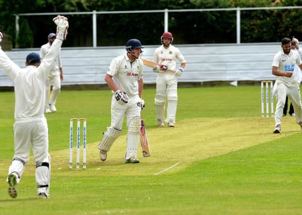 Birstall wicketkeeper Ian Carradice successfully appeals for a caught behind against Wrenthorpes James Glynn, who was dismissed for 49 off the bowling of Jaymish Patel in Saturdays Bradford League Championship One clash. Pictures: Andrew Bellis.
