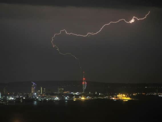 A lightning bolt over the Spinnaker Tower, Portsmouth last night as storms moved up the country toward Yorkshire. Picture: Steve Parsons/PA Wire