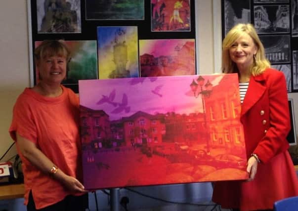 ARTWORK: Tracy Brabin collects the picture at TAP into Art Education, Batley Girls High School.
