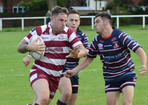 David Clayton scored a hat-trick of tries as Thornhill Trojans defeated Salford City Roosters to move up to second place in National Conference League Division Two last Saturday.