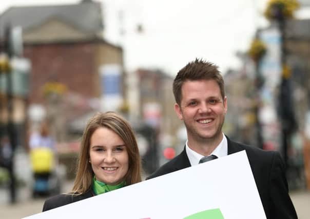 Yorkshire Building Society colleagues Kelly Swan and Jonathon Thewlis with a Charitable Foundation sign.