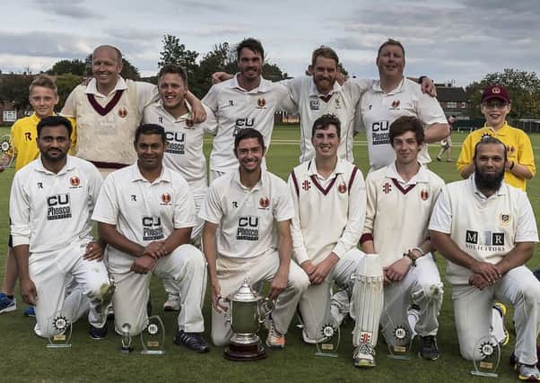 Hartshead Moor celebrate winning the Jack Hampshire Cup following a 21-run win over Wakefield St Michaels at Pudsey Congs last Sunday. Picture Ray Spencer