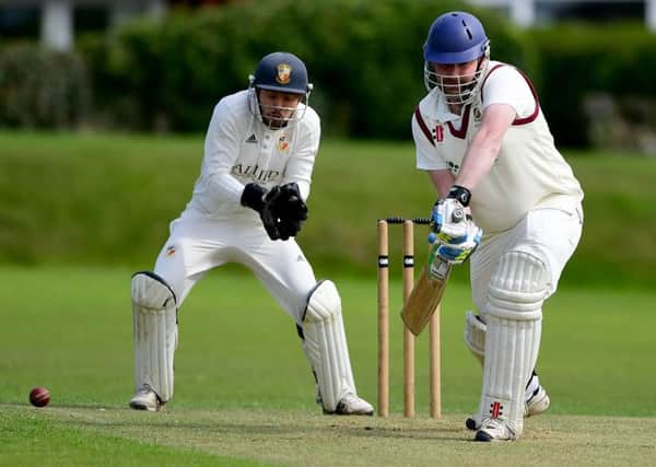 East Bierley batsman Ross Monaghan keeps a watchful eye on the ball during his sides Bradford Premier League defeat at home to Townville last Saturday as the South View Road men battle against the drop.