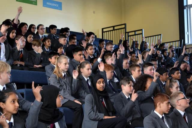 HANDS UP: Academy students try to answer one of Lukes questions.