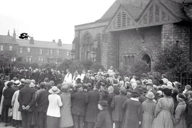 CONGREGATION: Members of St Marys Church, Savile Town, gather outside the building. The church was closed about 50 years ago. Photo loaned by Stuart Hartley.