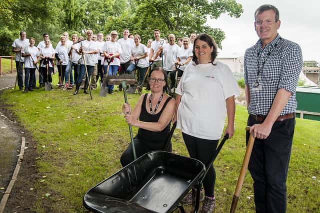 HSBC employees from across Yorkshire help create a new adventure play area for Gomersal Primary School in Cleakheaton

Deputy Head of Gomersall Primary Garry Norris, HSBC event co-ordinator Amy Bohanna (Centre)  and Teaching Assistant Mandy Hartley with the HSBC Volunteers
 
  22 August 2017 
  Copyright Paul David Drabble
  www.pauldaviddrabble.co.uk