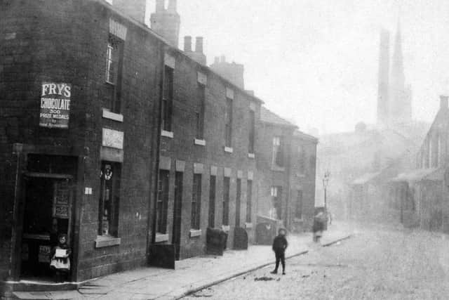 THE FLATTS: An old picture of Vulcan Road, Dewsbury. In the distance is the old boilermakers Horsfields. Most of this area was demolished in the late 1950s and early 60s.