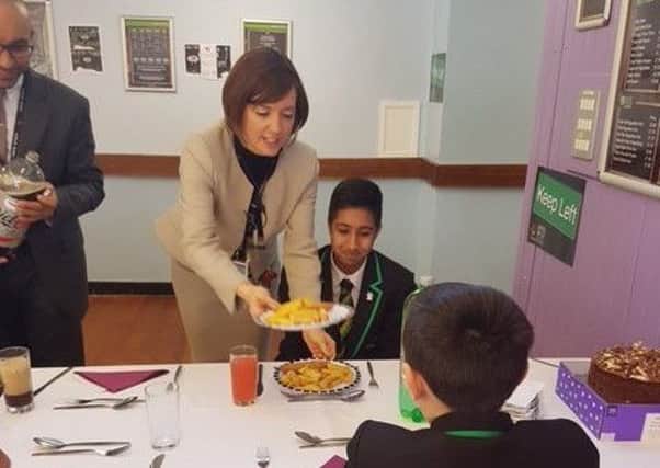 SERVING UP A TREAT: Headteacher Sam Vickers dishes out just rewards.