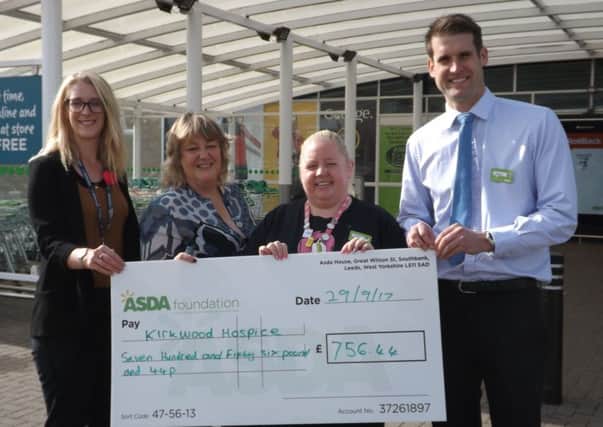 HOSPICE HELP: Staff at the Asda store present a cheque to Kirkwood Hospice representatives.