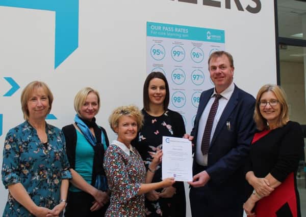 HIGH QUALITY: The Kirklees College team is presented with the Quality in Careers Standard.