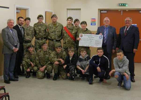 Members of the two Freemasons Lodges present a cheque to the Spen Valley Army Cadets.