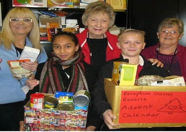 Healey Junior Infant and Nursery School presented a donation to the Batley Food Bank.