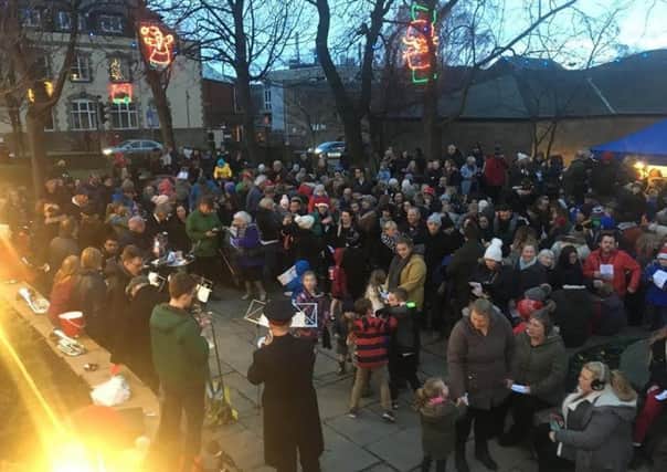 GOOD CROWD: Mirfield residents enjoy music by The Salvation Army around the Christmas tree.