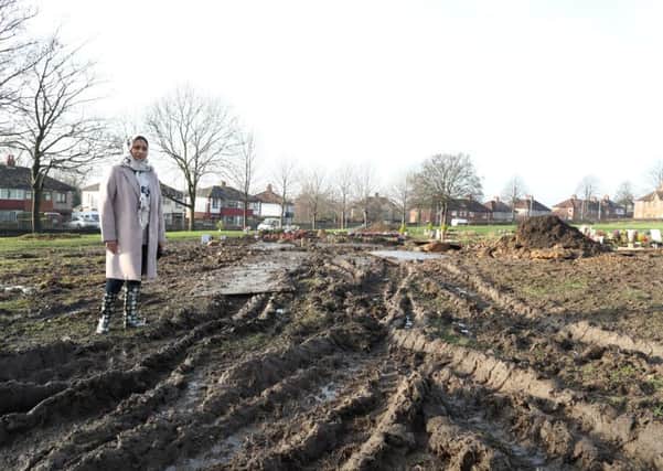 Mess: Vahida Birader at Dewsbury Cemetery where large, muddy tyre tracks have been left.