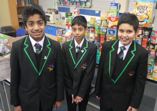 DONATIONS DRIVE: Upper Batley High School pupils stand in front of some of the donated items.