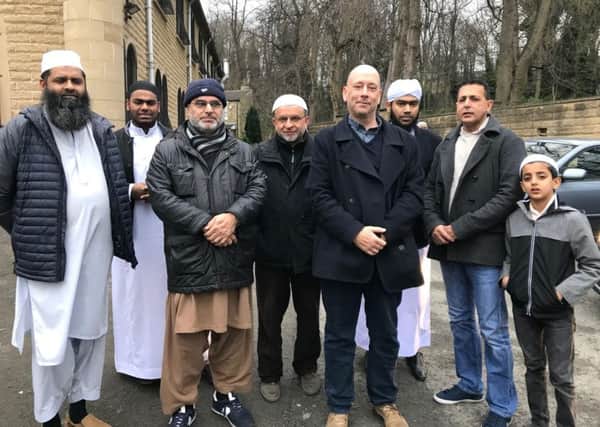 Protest: Mark Eastwood and Sajid Hussain with residents outside the  Hope Street Mosque, Dewsbury