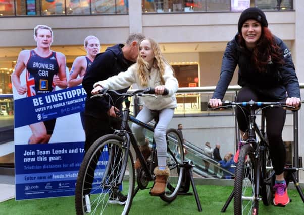 170118  Olympic Triathlete Lucy Hall takes on  Sophie Chapman, 10, in the triathlon challenge at Trinity Leeds on saturday .