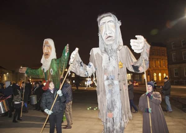 PROCESSION: Giant puppets have been created by Dewsbury residents to mark the Holocaust.