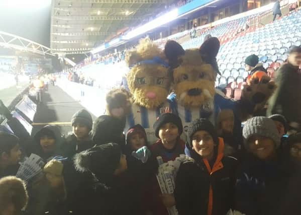 Mount Pleasant youngsters were treated to a day at the Premiership match between Huddersfield Town and West Ham United, while picking up tips from the Huddersfield Town Foundation coaches during a special training session.