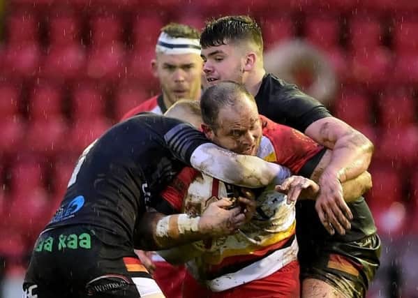Dewsbury forward Rob Spicer is stopped in his tracks.