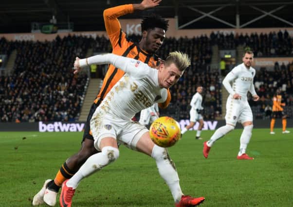 Ezgjan Alioski holds off Ola Aina in Leeds United's 0-0 draw at Hull City. Picture: Bruce Rollinson