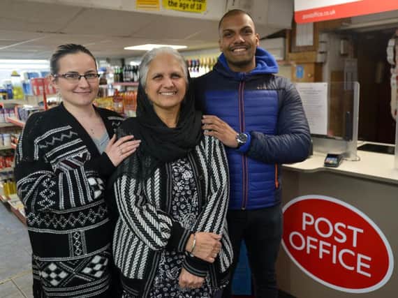 Jagindro Kaur (centre) will hand over the reigns of Battyeford Post Office to Jarmilah Baulovicova (left) and Randy Bacchus (right).