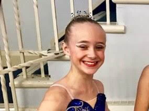 14-year-old ballerina Millie Birch requires surgery for a debilitating back injury.