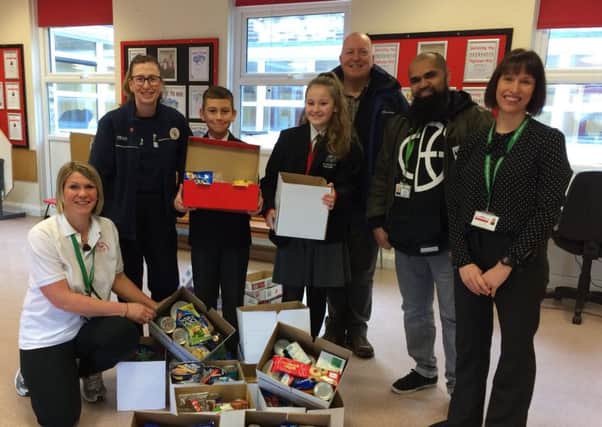 Pictured are teaching assistant Rachel Barker, Melanie Cropper (community champion, Tesco Cleckheaton), participating students, representatives from Fusion Giving, and Kelly Heddon (assistant headteacher).